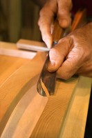 Image of Austin Joinery craftsmen carving a piece of furniture